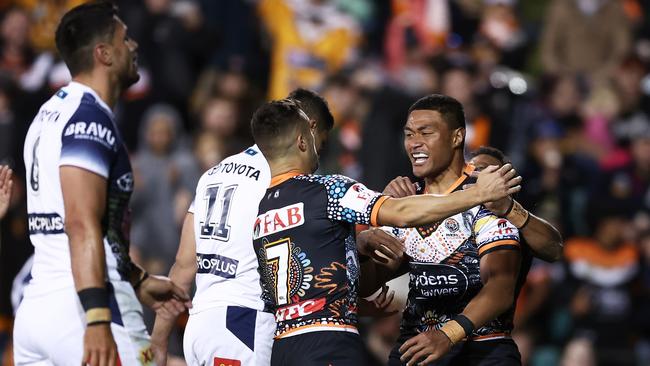 Stefano Utoikamanu celebrates with teammates after scoring a try. (Photo by Matt King/Getty Images)