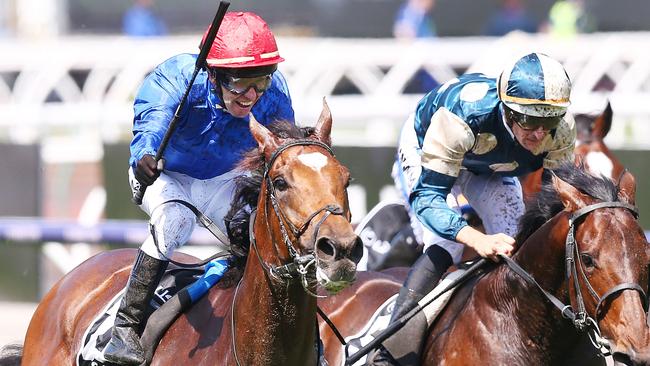Kerrin McEvoy (left) rides Cross Counter to victory in the 2018 Melbourne Cup. Picture: Getty Images