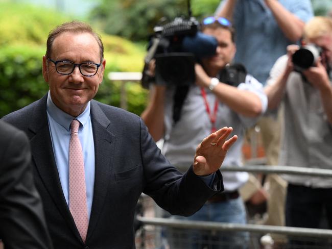 A smiling Kevin Spacey arrives at Southwark Crown Court in London. Picture: AFP