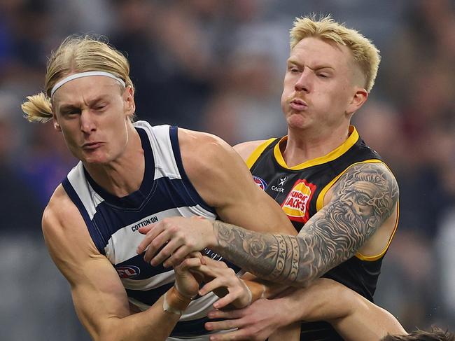 PERTH, AUSTRALIA - JUNE 01: Oliver Dempsey and Shaun Mannagh of the Cats contest for a mark against Ryan Maric of the Eagles during the round 12 AFL match between West Coast Eagles and Geelong Cats at Optus Stadium, on June 01, 2025, in Perth, Australia. (Photo by Paul Kane/Getty Images)