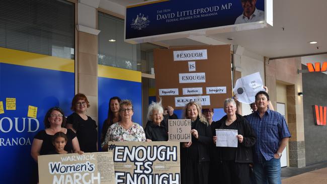 Eliza and Cynthia Hoffman, Julie Gliori, Jo McNally, Sue Hamlet, Jim and Judy Hefferan, Clare Cotton, Susan Cruickshank, Sue York, Marco Gliori, and Sandra Wilson at the women's rights protest outside Member for Maranoa David Littleproud's Palmerin St office.