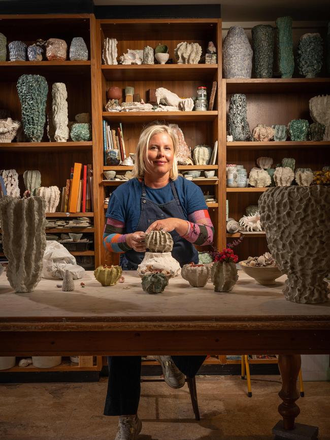 Barwon Heads sculptor and tile maker Sophia Legoe with her work that has a coastal, rugged feel. Picture: Brad Fleet