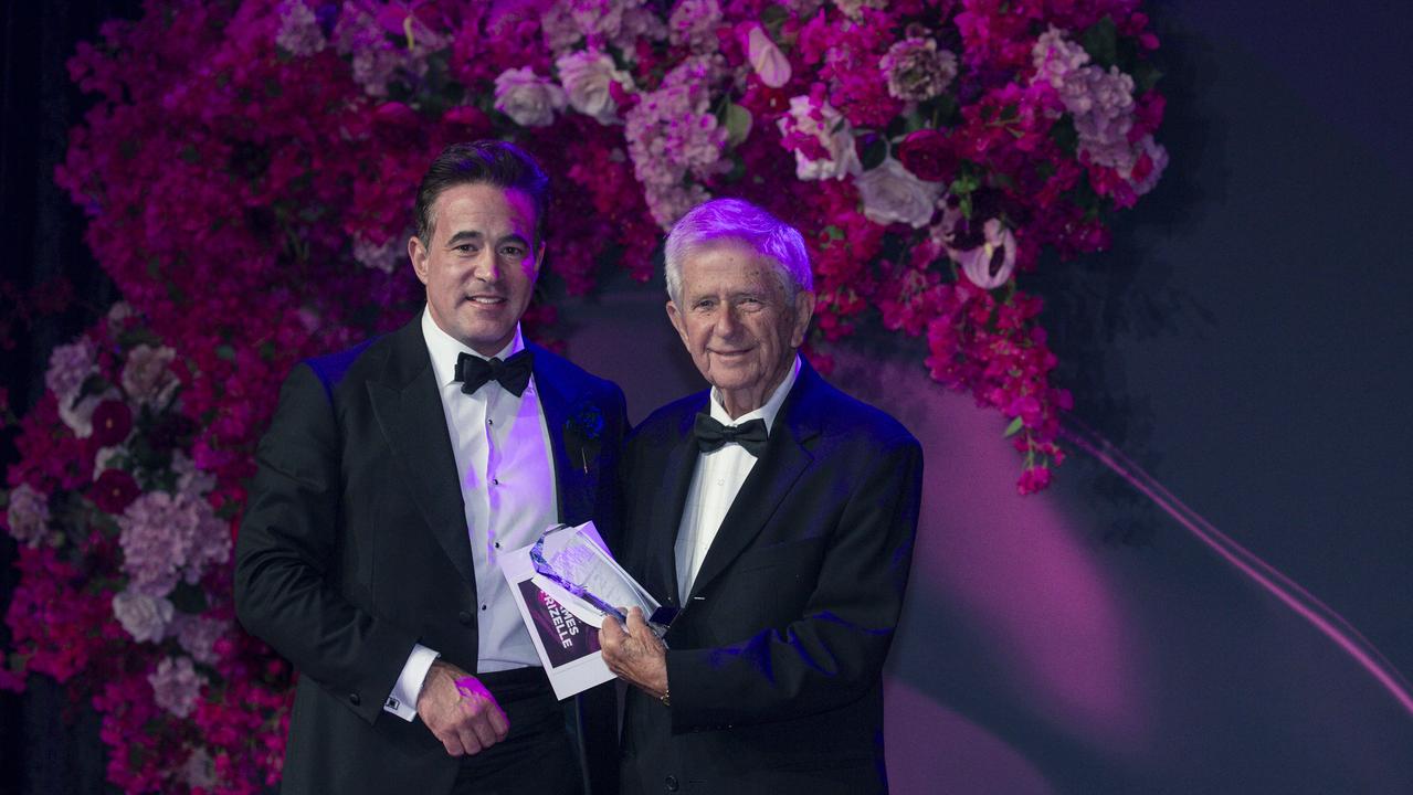 Village Roadshows Clarke Kirby (left) presents James Frizelle the Champion of Women Award at the Gold Coast Bulletin Women of the Year Awards. Picture: Glenn Campbell