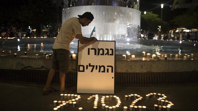 People light candles in memory of the civilians and soldiers killed, and for the hostages that were taken to the Gaza Strip. Picture: Getty Images