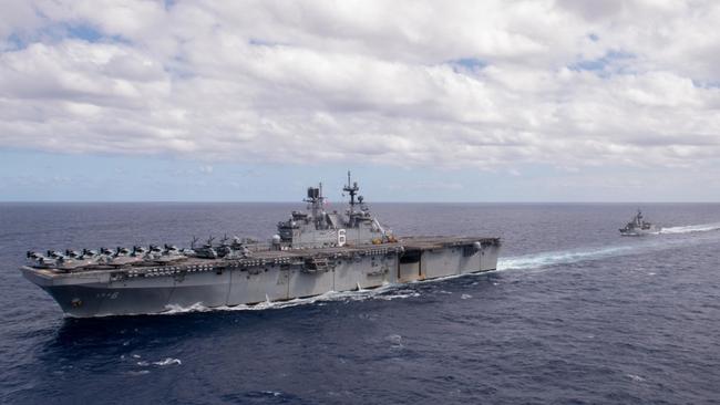 The forward-deployed amphibious assault ship USS America (LHA 6) conducts a fuelling-at-sea with the Royal Australian Navy frigate HMAS Ballarat (FFH 155) in support of flight deck operations during Exercise Talisman Sabre. Picture: Mass Communication Specialist 3rd Class Matthew Cavenaile/US Navy