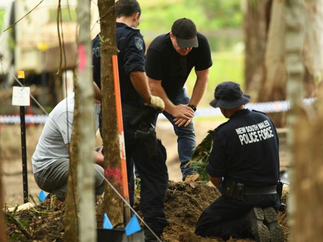 Strike Force Rosann detectives searching for William Tyrrell's remains inspect a piece of green hessian recovered from dirt in scrub off Batar Creek Rd, less than 900m from the Tyrrell's former family home at Kendall. Picture NCA NewsWire/Trevor Veale