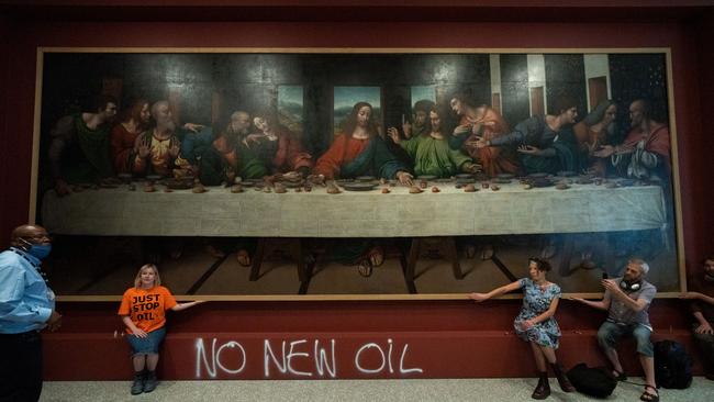 Activists in front of The Last Supper painting at the Royal Academy, London, in July. Picture: Getty Images