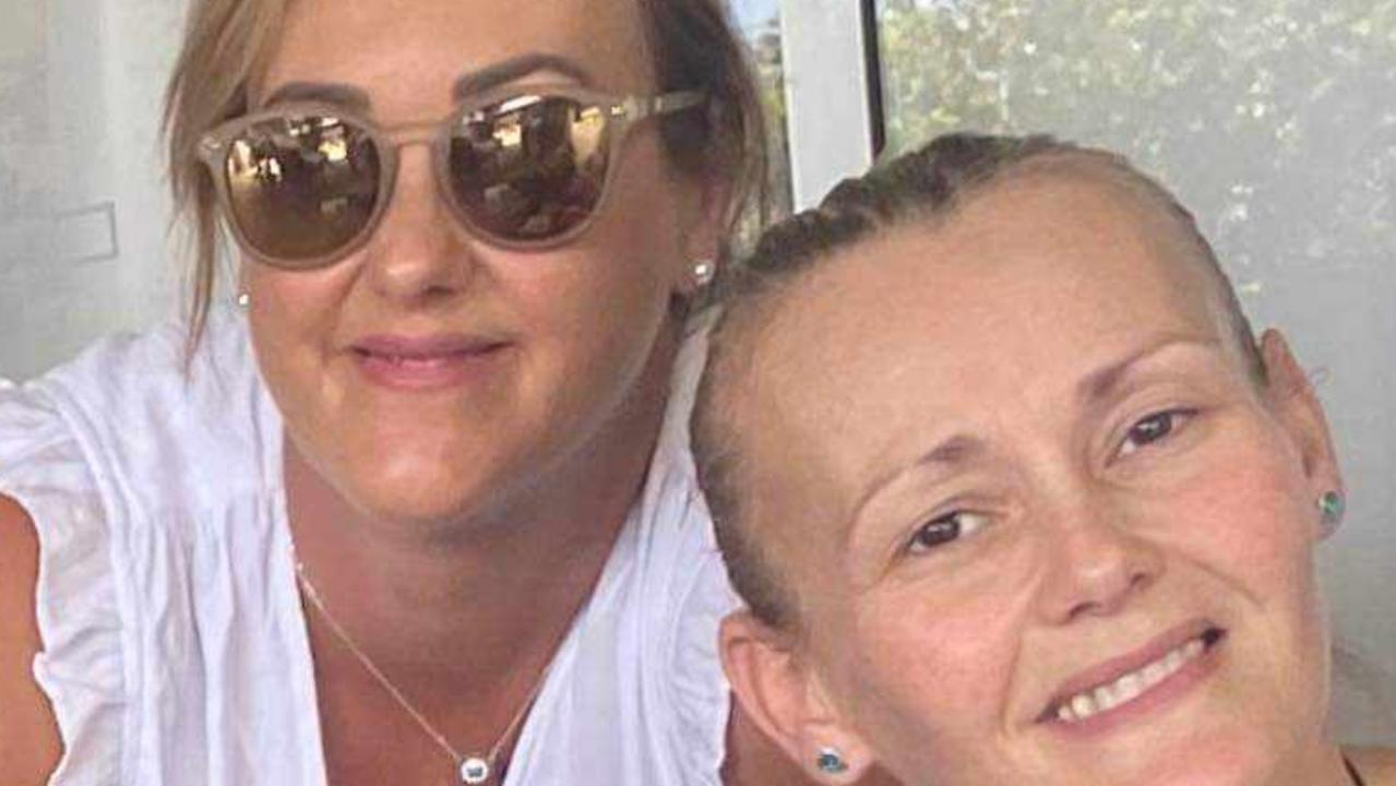 Bli Bli single mum-of-two Angie Evans, front, with her sister Leila Evans, has defied her doctors' terminal cancer diagnosis and is hoping for one more Christmas with her children.