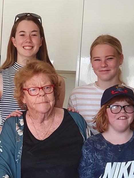 Vicki McKenzie, 74, pictured with her grand kids, is now clinging to life in hospital after a two-car crash on Creamery Rd, Bell Post Hill.