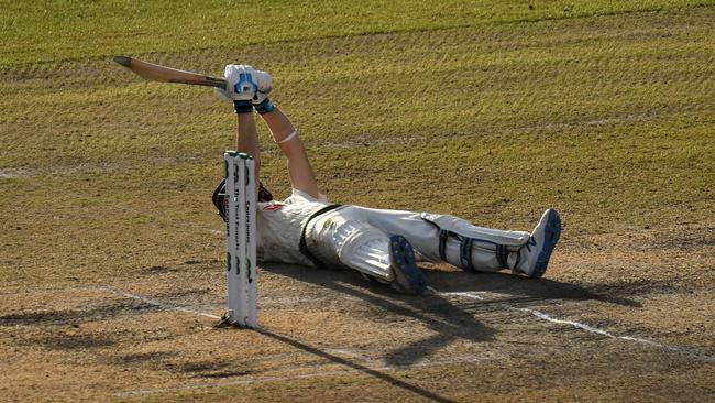 Steve Smith was still playing outrageous shots after ending up on the Old Trafford turf.