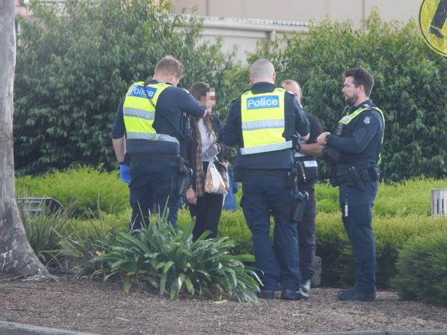 Police speaking to people outside the shopping centre. Picture: Supplied/LVI&amp;CA