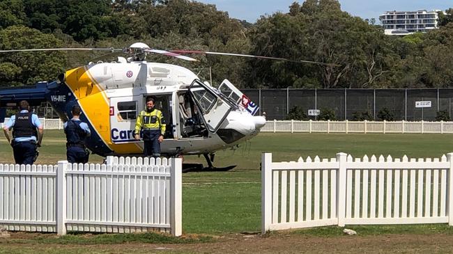 A CareFlight helicopter on L.M. Graham Reserve at Manly. It was called after reports of a man having a seizure while swimming at the Andrew 'Boy' Charlton Swim Centre at Manly. Picture: Julie Cross