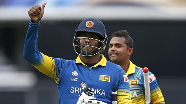 Sri Lanka’s captain Angelo Mathews (L) and Asela Gunaratne celebrate victory against India.