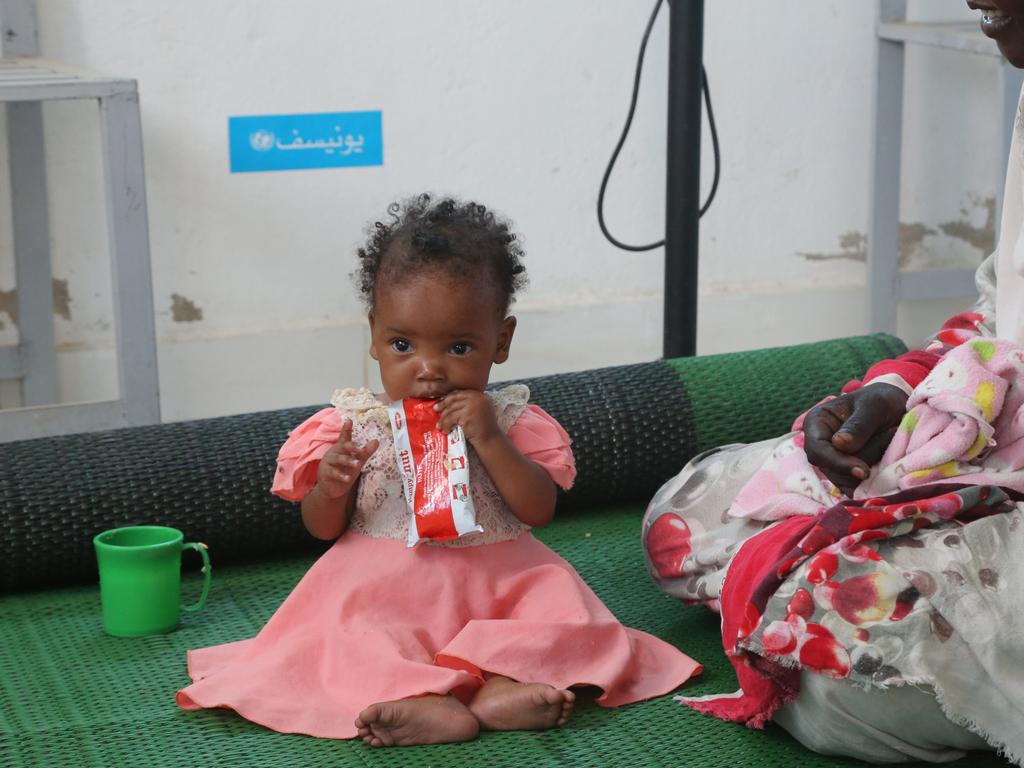 Seven-months-old Genan eats ready-to-use-therapeutic food during a visit to Damazine Children's hospital in Damazine, Blue Nile state, where she is admitted on a nutrition programme for treatment of malnutrition. Picture: UNICEF