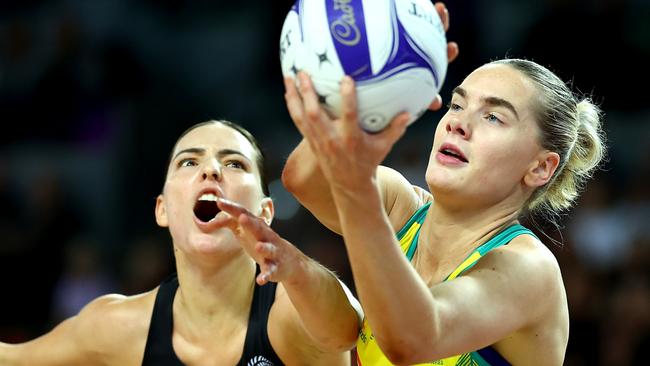 AUCKLAND, NEW ZEALAND - OCTOBER 23: Kiera Austin of Australia takes the pass ahead of Karin Burger of New Zealand during the game two of the Constellation Cup series between New Zealand Silver Ferns and Australia Diamonds at Spark Arena on October 23, 2024 in Auckland, New Zealand. (Photo by Phil Walter/Getty Images)