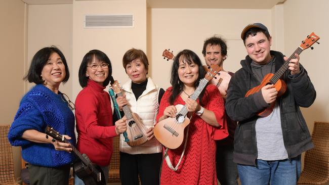 Izumi Nago with music therapy students (L to R) Yasco Pierce, Tachi, Michie Spain, Luke Abdullah and Phillip Pogossov at her studio in Pennant Hills Tuesday July 24, 2018.She runs music classes for kids with disabilities. (AAP IMAGE/Simon Bullard)