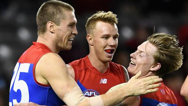 Melbourne players celebrate their win over Essendon. Picture: Getty Images