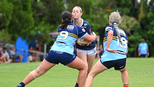 Cop that - Norths defend in an U19 women's rugby league trial game against the Falcons.