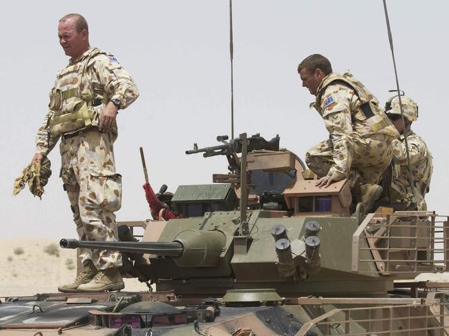 Pictured standing is Lieutenant Colonel Roger Noble, now Major General. He led the Al Muthanna Task Group (AMTG) in Iraq, in 2005. It was his second posting to Iraq.