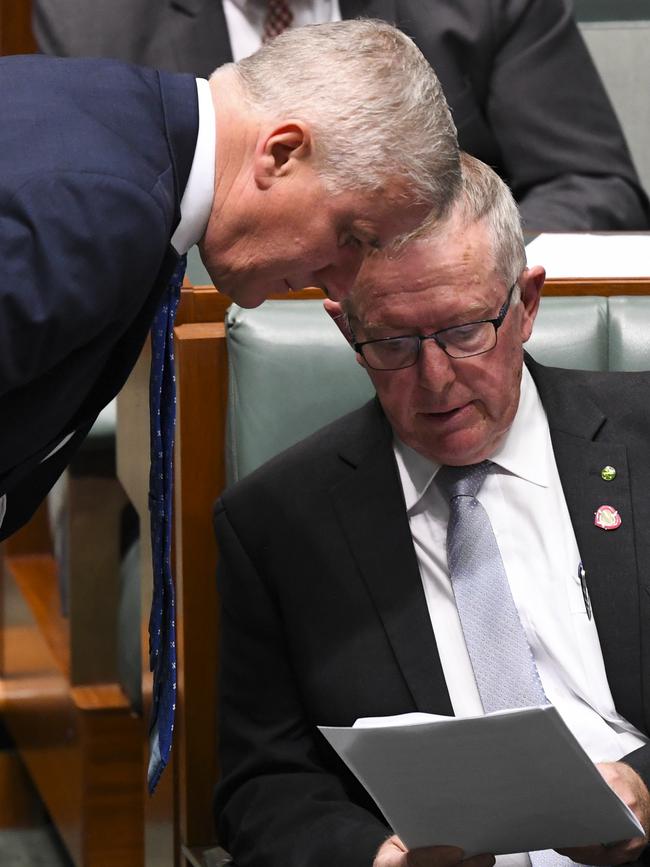 Minister for Regional Services Mark Coulton, right, speaks to Deputy Prime Minister Michael McCormack. Picture: AAP