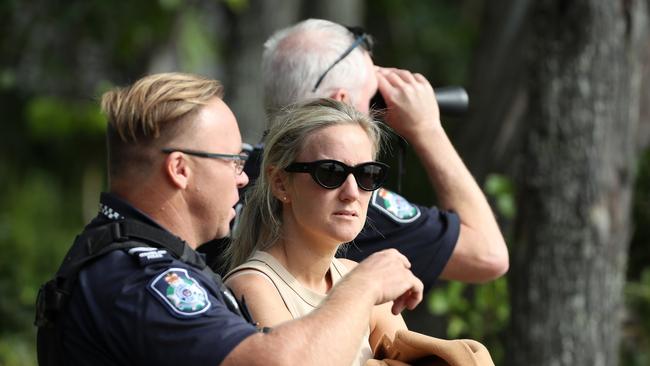 Jordan Kelly's sister Danielle Brittain speaks to police as the search for her brother unfolds in waters off North Stradbroke Island. Picture: Liam Kidston