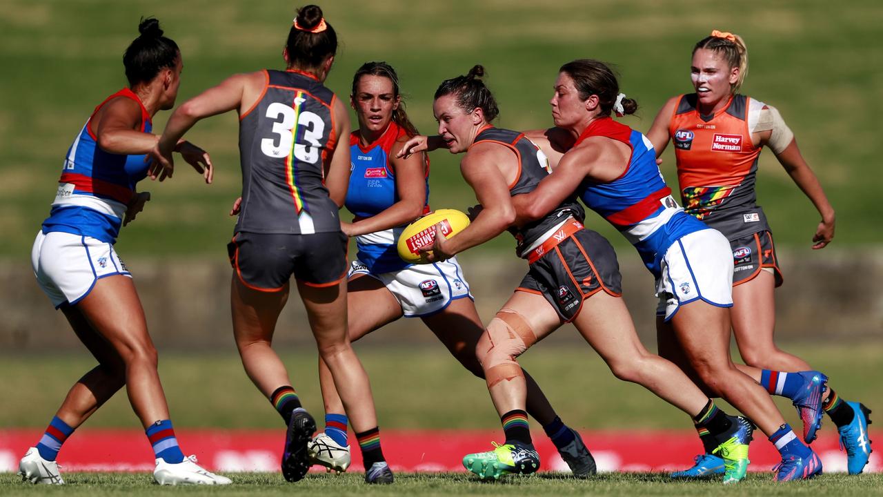 Giant Alyce Parker tries to break through an Ellie Blackburn tackle. Picture: Dylan Burns/AFL Photos