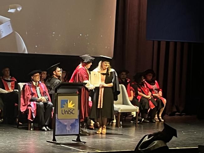 Graduates from the University of the Sunshine Coast's Fraser Coast campus celebrating at the Brolga Theatre.