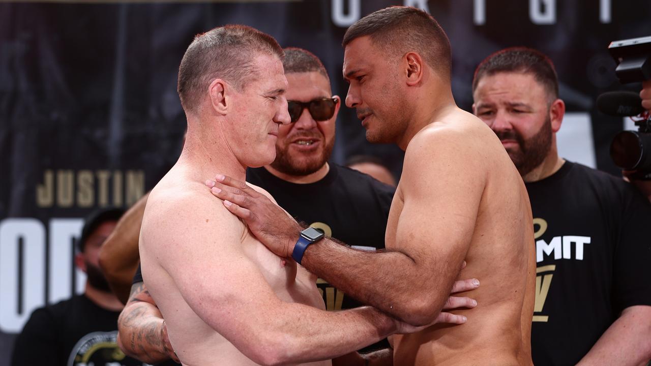 Paul Gallen and Justin Hodges during the official weigh in. (Photo by Chris Hyde/Getty Images)
