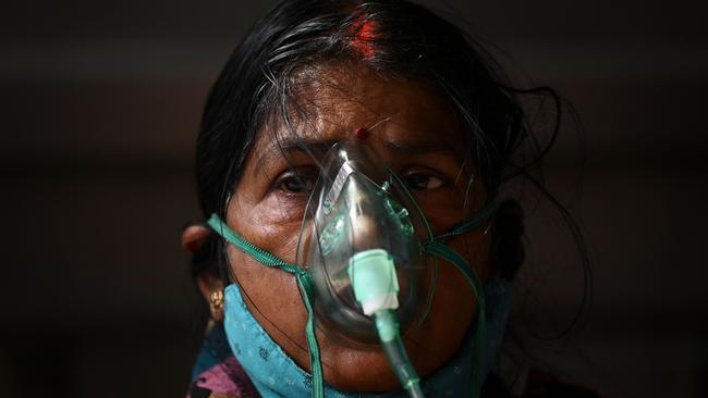 A COVID-19 patient breathes with the help of oxygen. Picture: Sajjad HUSSAIN / AFP