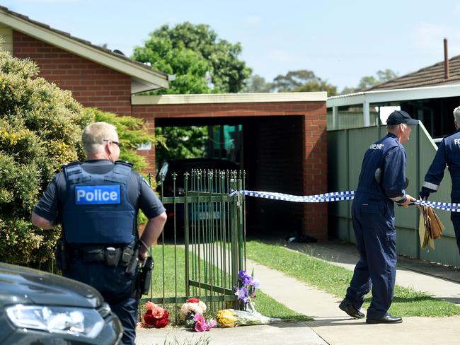 Police and forensic teams at the house on Sunday.