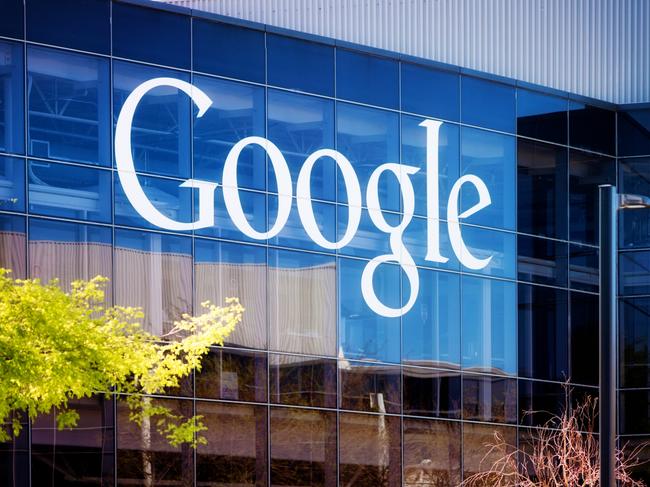 Mountain View, USA - March 4, 2015: Google headquarters logo on Mountain view California glass office building on a late Winter morning. Wide horizontal panoramic image.