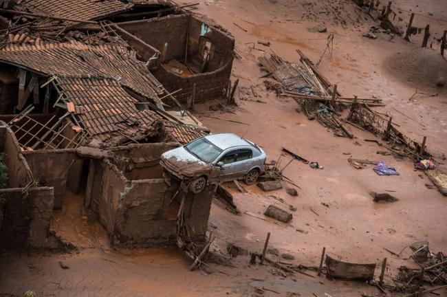 The ruptured dam unleashed a deluge of thick, red toxic mud