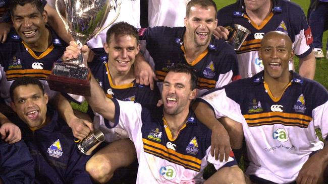 MAY 26, 2001 : ACT Brumbies team with trophy celebrate victory over the Coastal Sharks after the grand final of the Super 12 RU game at Bruce Stadium, Canberra, 26/05/01. Pic John Feder. Rugby Union