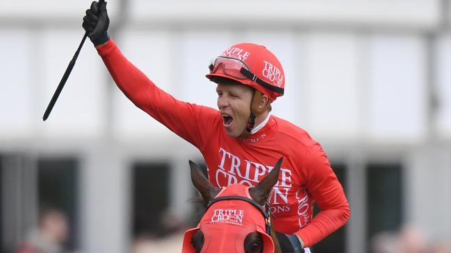 Jockey Kerrin McEvoy on Redzel gestures to the crowd after winning The TAB Everest race during The TAB Everest race day at Royal Randwick Race Course, in Sydney, Saturday, October 14, 2017. (AAP Image/David Moir) NO ARCHIVING, EDITORIAL USE ONLY