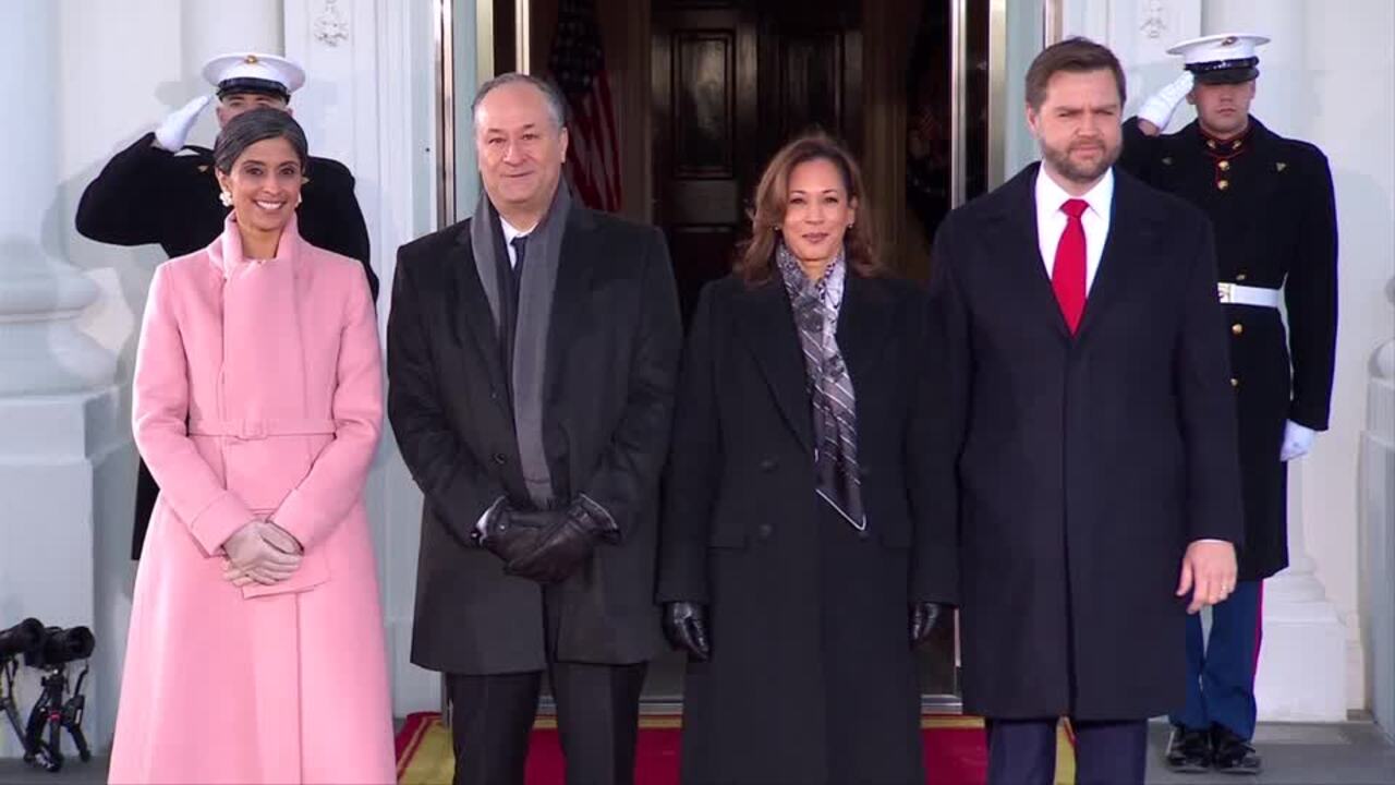 Harris, Emhoff greet Vances in front of the White House