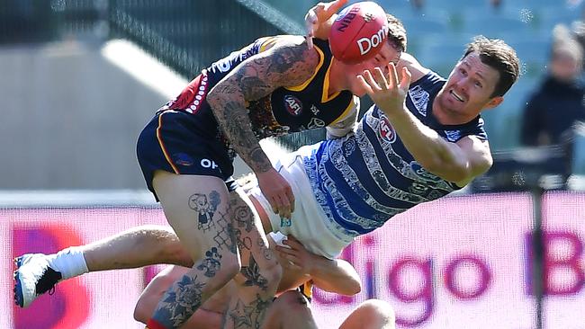 Cats midfielder Patrick Dangerfield is hit in a tackle Harry Schoenberg Picture: Getty Images