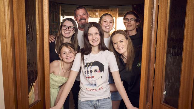 Grace Moores, 15, with her family, Chloe Moores, 12, Tiana Moores, Dale Moores, Aleysha Moores, Billy Moores and Marie Moores at home in Greenwith, 6 years after Katy Perry performed at her home. Picture: Matt Loxton