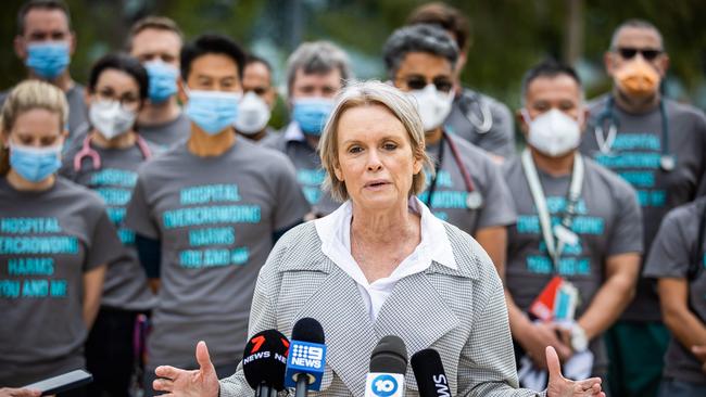 SASMOA Chief Industrial Officer Bernadette Mulholland speaks to the media with doctors at the Royal Adelaide Hospital ED wearing protest slogan t-shirts. Picture: Tom Huntley