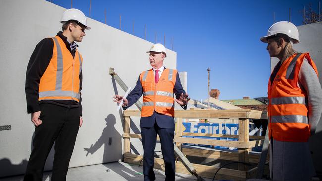 Tasmanian Premier Peter Gutwein (centre) talks to Goulburn St Site Manager, Philip De Jong (left) and Elise Archer. Picture: Richard Jupe