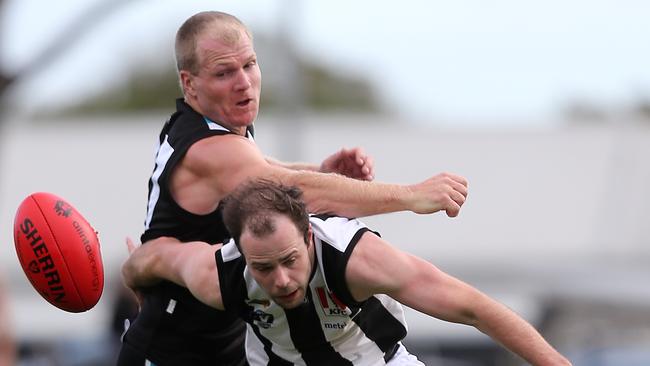 Wonthaggi player Tom Davey and Sale’s Jesse Collins battle for the ball. Picture: Yuri Kouzmin