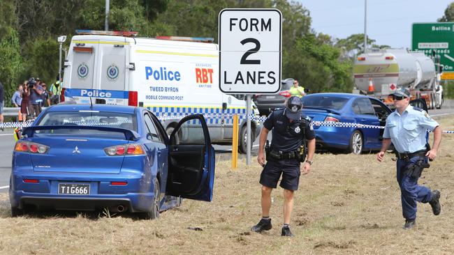 Queensland and NSW police with ambulance crews at the end of the chase at Tweed Heads. Picture: Mike Batterham