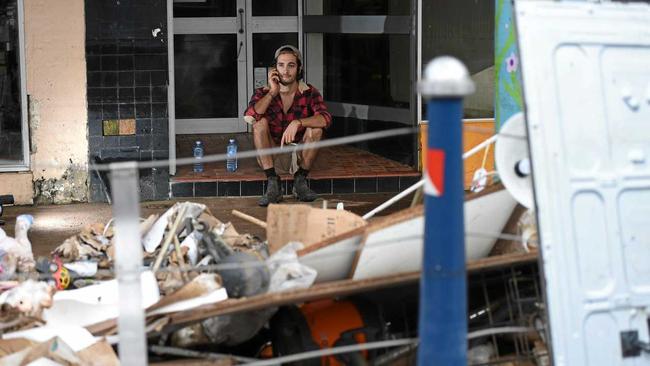 Salvador Diaz, of Lismore, takes a break from cleaning up. Picture: Marc Stapelberg