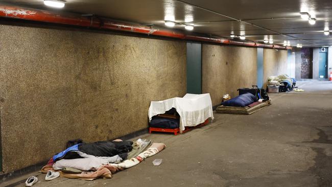 Homeless sleep rough in an underground Hyde Park walkway in Sydney. Many homeless people are sufferers of severe mental illness but receive little support. Picture: Richard Dobson