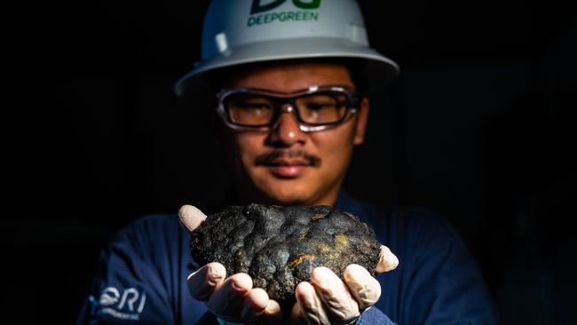 Teng King Kuen holds a class 3 polymetallic nodule. Picture: DeepGreen