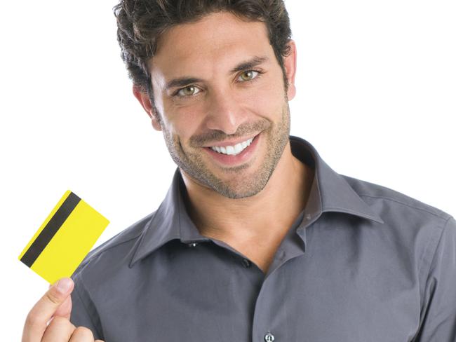 A young man holding a credit card. Picture: iStock.