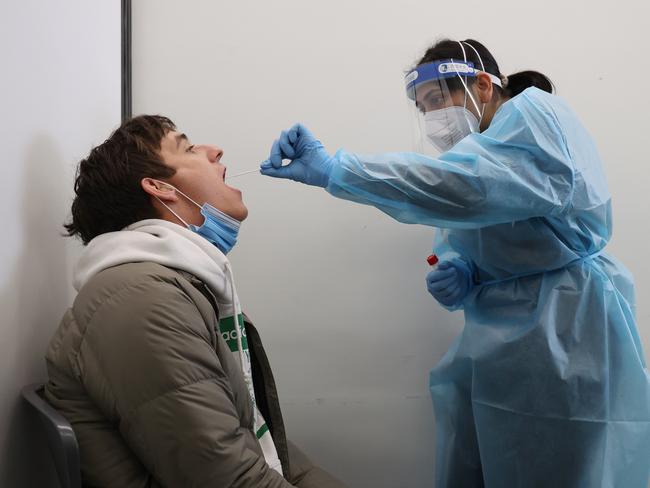 ADELAIDE, AUSTRALIA - NewsWire Photos July 27 2022: Peter Hennell is given a PCR test by nurse Harman Deep in the new Kilkenny clinic. South Australian Health Minister Chris Picton has opened a new respiratory clinic in Kilkenny, Adelaide. NCA NewsWire / David Mariuz