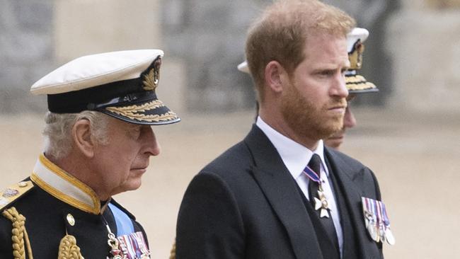 Britain's King Charles III (L) walks with his son Britain's Prince Harry, Duke of Sussex as they arrive at St George's Chapel inside Windsor Castle on September 19, 2022, ahead of the Committal Service for Britain's Queen Elizabeth II. - Monday's committal service is expected to be attended by at least 800 people, most of whom will not have been at the earlier State Funeral at Westminster Abbey. (Photo by David Rose / POOL / AFP)