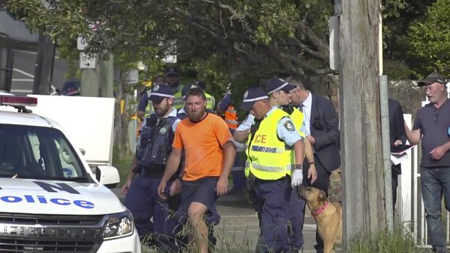 Morgan Haverfield-Price (in orange T-shirt) is arrested after the fatality. Picture: TNV