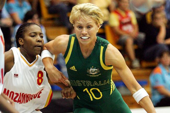 Erin Phillips drives to the basket as she elbows Amelia Macamo at the Melbourne 2006 Commonwealth Games - Mozambique v Australia.