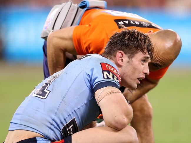 TOWNSVILLE, AUSTRALIA - JUNE 09:  Cameron Murray of the Blues is attended to by a trainer during game one of the 2021 State of Origin series between the New South Wales Blues and the Queensland Maroons at Queensland Country Bank Stadium on June 09, 2021 in Townsville, Australia. (Photo by Mark Kolbe/Getty Images)